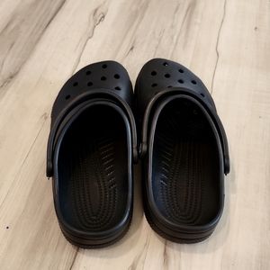 A black pair of crocs
